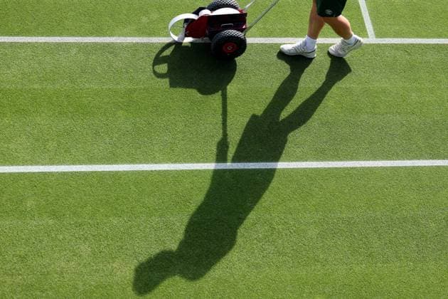6th July 2023; All England Lawn Tennis and Croquet Club, London, England: Wimbledon Tennis Tournament; A Wimbledon groundsman paints the court lines  ActionPlus12527514 ShaunxBrooks