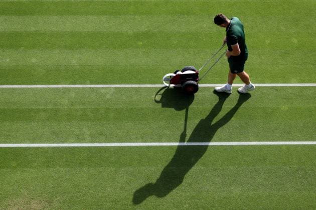 6th July 2023; All England Lawn Tennis and Croquet Club, London, England: Wimbledon Tennis Tournament; A Wimbledon groundsman paints the court lines  ActionPlus12527515 ShaunxBrooks