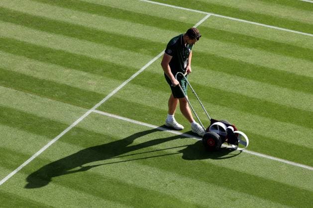 6th July 2023; All England Lawn Tennis and Croquet Club, London, England: Wimbledon Tennis Tournament; A Wimbledon groundsman paints the court lines  ActionPlus12527516 ShaunxBrooks