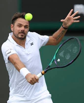 (230706) -- LONDON, July 6, 2023 -- Stan Wawrinka hits a return during the men s singles second round match between Tomas Martin Etcheverry of Argentina and Stan Wawrinka of Switzerland at Wimbledon Tennis Championships in London, Britain, July 6, 2023. ) (SP)BRITAIN-LONDON-TENNIS-WIMBLEDON-DAY 4 HanxYan 