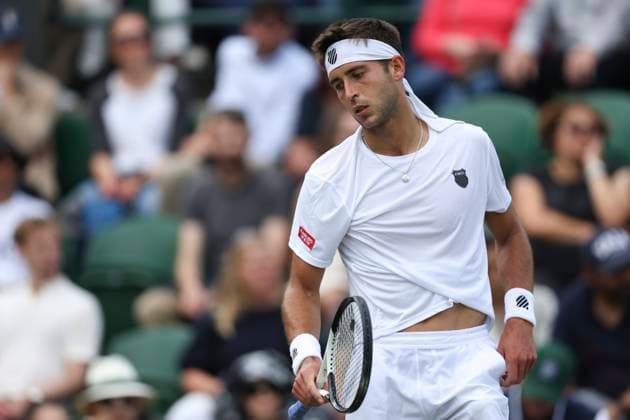 (230706) -- LONDON, July 6, 2023 -- Tomas Martin Etcheverry reacts during the men s singles second round match between Tomas Martin Etcheverry of Argentina and Stan Wawrinka of Switzerland at Wimbledon Tennis Championships in London, Britain, July 6, 2023. ) (SP)BRITAIN-LONDON-TENNIS-WIMBLEDON-DAY 4 HanxYan 