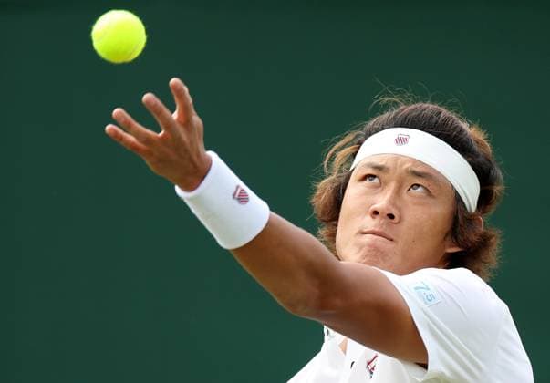 (230706) -- LONDON, July 6, 2023 -- Zhang Zhizhen serves during the men s singles first round match between Zhang Zhizhen of China and Botic van de Zandschulp of the Netherlands at Wimbledon tennis Championships in London, Britain, July 6, 2023. ) (SP)BRITAIN-LONDON-TENNIS-WIMBLEDON-DAY 4 LixYing 