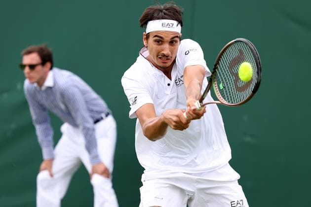 6th July 2023; All England Lawn Tennis and Croquet Club, London, England: Wimbledon Tennis Tournament; Lorenzo Sonego plays a backhand shot to Matteo Berrettini  ActionPlus12527770 ShaunxBrooks