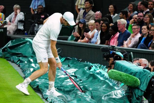 Mandatory Credit: Photo by Javier Garcia Shutterstock (13995919jv) Andy Murray strikes the court cover during his second round match Wimbledon Tennis Championships, Day 4, The All England Lawn Tennis and Croquet Club, London, UK - 06 Jul 2023 Wimbledon Tennis Championships, Day 4, The All England Lawn Tennis and Croquet Club, London, UK - 06 Jul 2023  Copyright: xJavierxGarcia Shutterstockx 13995919jv