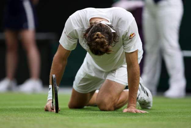 (230707) -- LONDON, July 7, 2023 -- Stefanos Tsitsipas of Greece slips during the men s singles second round match between Andy Murray of Britain and Stefanos Tsitsipas of Greece at Wimbledon tennis Championship in London, Britain, on July 6, 2023. ) (SP)BRITAIN-LONDON-TENNIS-WIMBLEDON-DAY 4 HanxYan 