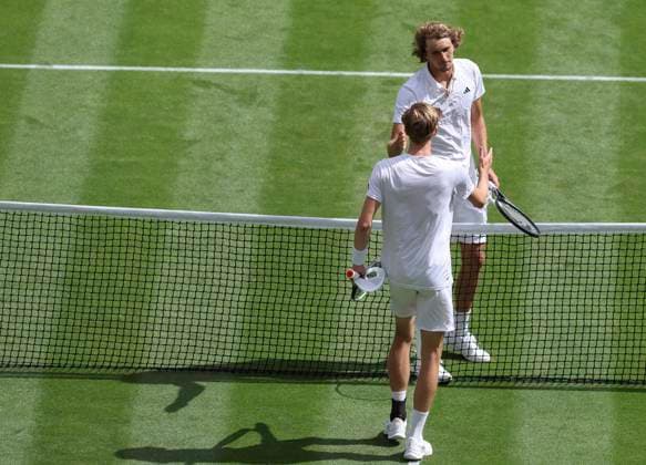 (230707) -- LONDON, July 7, 2023 -- Alexander Zverev(R) of Germany shakes hands with Gijs Brouwer of the Netherlands after their men s singles first round match at Wimbledon tennis Championship in London, Britain, on July 6, 2023. ) (SP)BRITAIN-LONDON-TENNIS-WIMBLEDON-DAY 4 HanxYan 