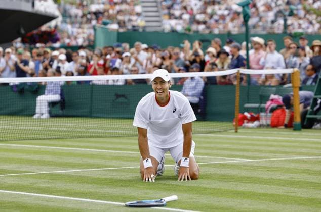 Tennis: Wimbledon championships Yosuke Watanuki of Japan falls to his knees after winning his men s singles first-round match against Marc-Andrea Huesler of Switzerland at the Wimbledon tennis tournament in London on July 6, 2023.  A14AA0001655047P  