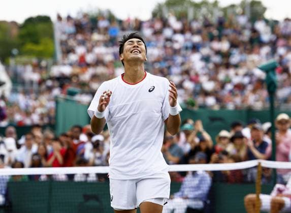 Tennis: Wimbledon championships Yosuke Watanuki of Japan celebrates after winning his men s singles first-round match against Marc-Andrea Huesler of Switzerland at the Wimbledon tennis tournament in London on July 6, 2023.  A14AA0001655048P  