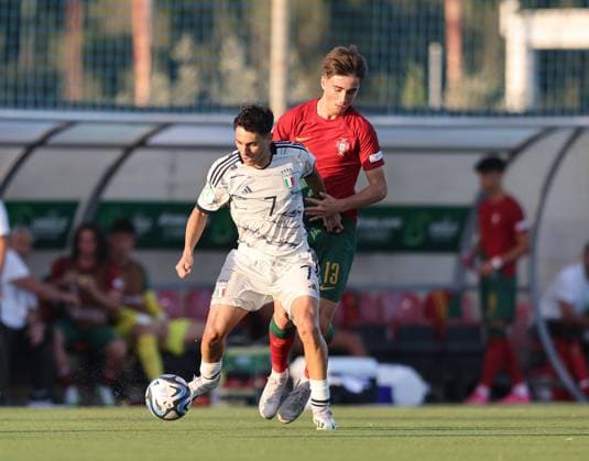 (230707) -- MALTA, July 7, 2023 -- Italy s Luis Hasa (L) moves forward with the ball during the UEFA Under-19 EURO championship final tournament Group A football match between Portugal and Italy at the Centenary Stadium, in Ta Qali, Malta, on July 6, 2023. (Photo by Xinhua) (SP)MALTA-TA QALI-FOOTBALL-UEFA UNDER-19 EURO FINAL TOURNAMENT-PORTUGAL VS ITALY JonathanxBorg 