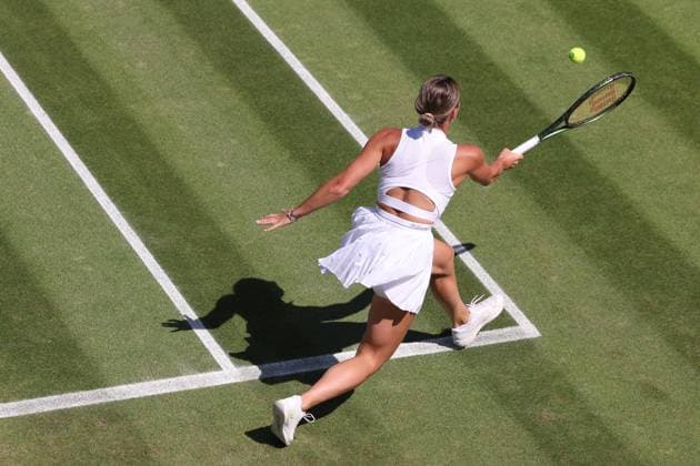 7th July 2023; All England Lawn Tennis and Croquet Club, London, England: Wimbledon Tennis Tournament; Marta Kostyuk returns the serve from Paula Badsoa  ActionPlus12527907 ShaunxBrooks