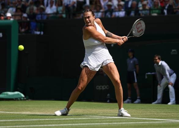 Belarussian Arnya Sabalenka plays a backhand in her second round match against France s Varvara Gracheva on day five of the 2023 Wimbledon championships in London on Friday, July 07, 2023.  LON2023070733 HUGOxPHILPOTT