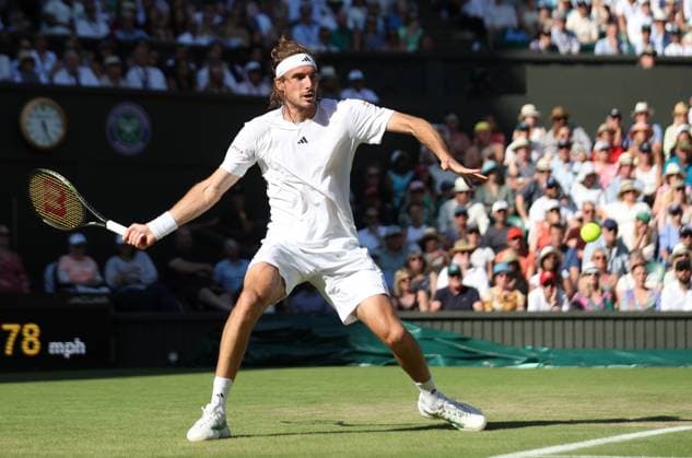 Greek Stefanos Tsitsipas plays a forehand in his second round match against Great Britain s Andy Murray on day five of the 2023 Wimbledon championships in London on Friday, July 07, 2023.  LON2023070778 HUGOxPHILPOTT