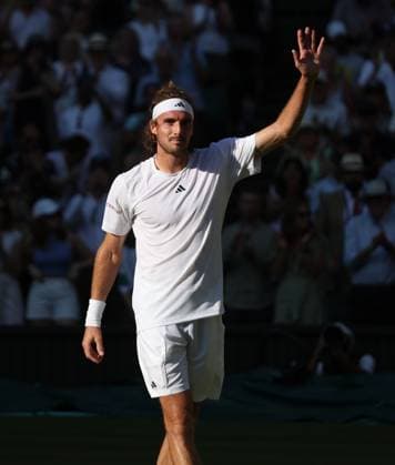 Greek Stefanos Tsitsipas celebrates victory in his second round match against Great Britain s Andy Murray on day five of the 2023 Wimbledon championships in London on Friday, July 07, 2023.  LON2023070757d HUGOxPHILPOTT