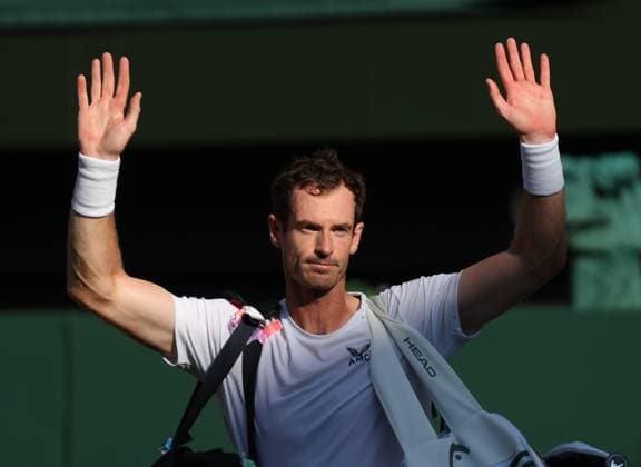Great Britain s Andy Murray waves goodbye after defeat in his second round match against Greek Stefanos Tsitsipas on day five of the 2023 Wimbledon championships in London on Friday, July 07, 2023.  LON2023070771 HUGOxPHILPOTT