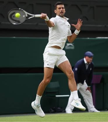 Serbian Novak Djokovic plays a forehand in his third round match against Swiss Stan Wawrinka on day five of the 2023 Wimbledon championships in London on Friday, July 07, 2023.  LON2023070792 HUGOxPHILPOTT