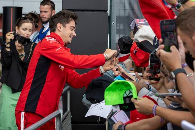 8th July 2023: Silverstone Circuit, Northamptonshire, England: Formula 1 2023 Aramco British F1 Grand Prix: Qualifying Day; Scuderia Ferrari driver Charles Leclerc signs an autograph  ActionPlus12528543 TimxWilliams