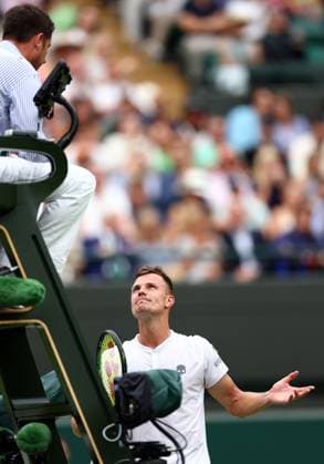 Mandatory Credit: Photo by Simon Dael Shutterstock (14001530bz) Marton Fucsovics talks to the umpire during his third round match Wimbledon Tennis Championships, Day 6, The All England Lawn Tennis and Croquet Club, London, UK - 08 Jul 2023 Wimbledon Tennis Championships, Day 6, The All England Lawn Tennis and Croquet Club, London, UK - 08 Jul 2023  Copyright: xSimonxDael Shutterstockx 14001530bz