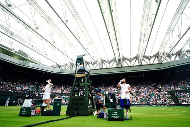 Mandatory Credit: Photo by Javier Garcia Shutterstock (14001532dn) Carlos Alcaraz and Nicolas Jarry between games during their third round match Wimbledon Tennis Championships, Day 6, The All England Lawn Tennis and Croquet Club, London, UK - 08 Jul 2023 Wimbledon Tennis Championships, Day 6, The All England Lawn Tennis and Croquet Club, London, UK - 08 Jul 2023  Copyright: xJavierxGarcia Shutterstockx 14001532dn