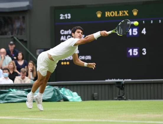 Spain s Carlos Alcaraz plays a backhand in his match against Chilean Nicolas Jarry on day six of the 2023 Wimbledon championships in London on Saturday, July 08, 2023.  LON2023070832 HUGOxPHILPOTT