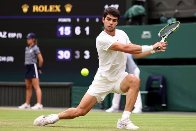 8th July 2023; All England Lawn Tennis and Croquet Club, London, England: Wimbledon Tennis Tournament; Carlos Alcaraz plays a backhand shot to Nicolas Jerry  ActionPlus12528673 ShaunxBrooks
