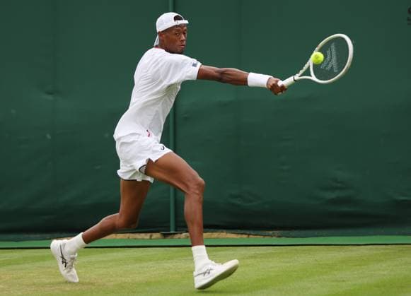 American Christopher Eubanks plays a backhand in his match against Australian Christopher O Connell on day six of the 2023 Wimbledon championships in London on Saturday, July 08, 2023.  LON2023070850 HUGOxPHILPOTT