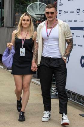 9th July 2023: Silverstone Circuit, Northamptonshire, England: Formula 1 2023 Aramco British F1 Grand Prix: Race Day; Adam Peaty and his girlfriend Holly Ramsey, daughter of Gordon Ramsey, hand in had in the Silverstone paddock  ActionPlus12529108 TimxWilliams