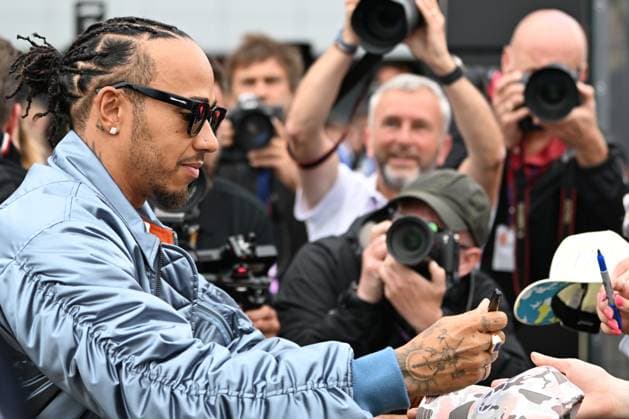 9th July 2023: Silverstone Circuit, Northamptonshire, England: Formula 1 2023 Aramco British F1 Grand Prix: Race Day; Lewis Hamilton of the Mercedes team poses for selfies and signs autographs on arrival at Silverstone  ActionPlus12529134 SimonxWest