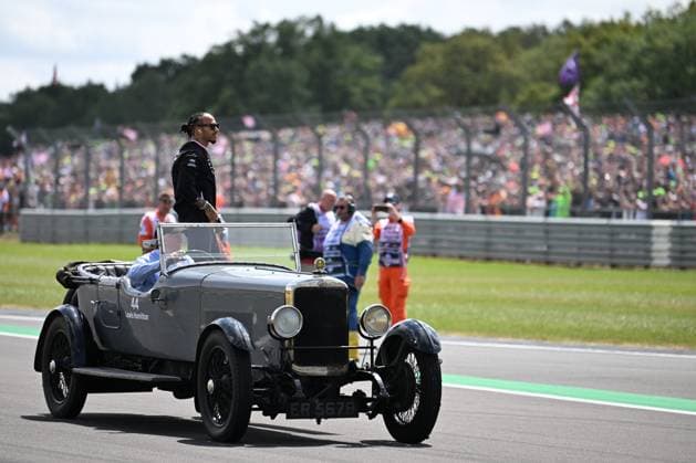 9th July 2023: Silverstone Circuit, Northamptonshire, England: Formula 1 2023 Aramco British F1 Grand Prix: Race Day; Lewis Hamilton of the Mercedes team waves to fans while being driven round Silverstone track before the Grand Prix  ActionPlus12529157 SimonxWest