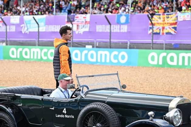 9th July 2023: Silverstone Circuit, Northamptonshire, England: Formula 1 2023 Aramco British F1 Grand Prix: Race Day; Lando Norris of the McLaren-Mercedes team waves to fans while being driven round Silverstone track before the Grand Prix  ActionPlus12529171 SimonxWest