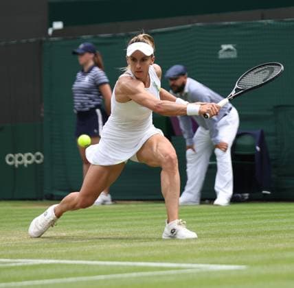 Ukraine s Lesia Tsurenko plays a backhand in her match against American Jessica Pegula on day seven of the 2023 Wimbledon championships in London on Sunday, July 9, 2023.  LON20230709298 HUGOxPHILPOTT