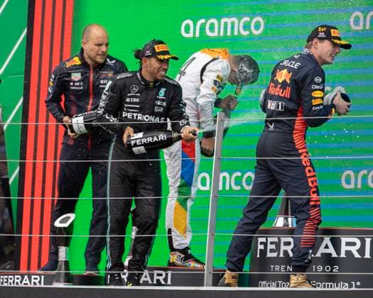 9th July 2023: Silverstone Circuit, Northamptonshire, England: Formula 1 2023 Aramco British F1 Grand Prix: Race Day; Mercedes-AMG Petronas F1 Team driver Lewis Hamilton sprays Champagne over Oracle Red Bull Racing driver Max Verstappen  ActionPlus12529287 TimxWilliams