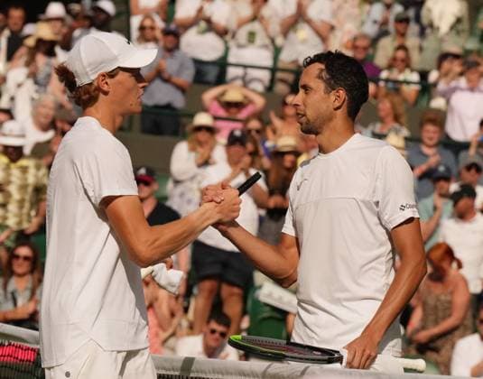 Tennis - 2023 Wimbledon Championships - Week One - Day Seven - All England lawn Tennis & Racquet Club, Wimbledon - Sunday 9th Mens singles - Yannick Sinner (ITA) v Daniel Elahi Galan (COL) Yannick Sinner at the net after victory 