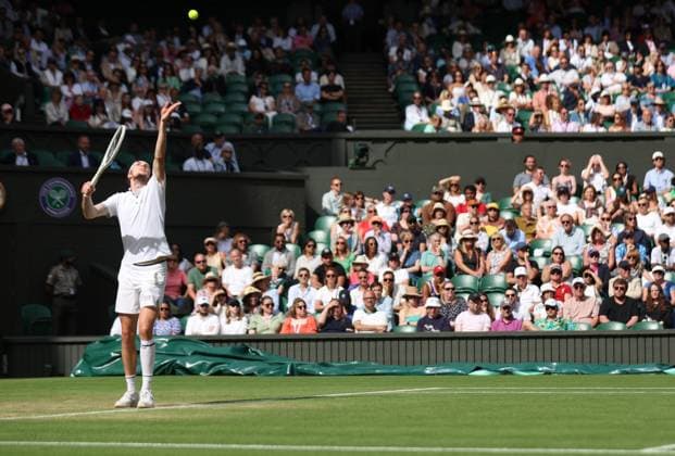 Kazakhstan s Alexander Bublik serves in his match against Russian Andrey Rublev on day seven of the 2023 Wimbledon championships in London on Sunday, July 9, 2023.  LON2023070938 HUGOxPHILPOTT