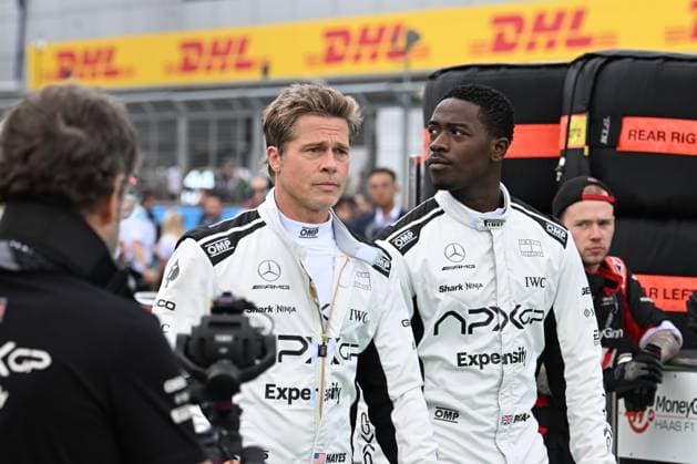9th July 2023: Silverstone Circuit, Northamptonshire, England: Formula 1 2023 Aramco British F1 Grand Prix: Race Day; Brad Pitt and Damson Idris during filming on the starting grid at the start of the Grand Prix  ActionPlus12529304 SimonxWest