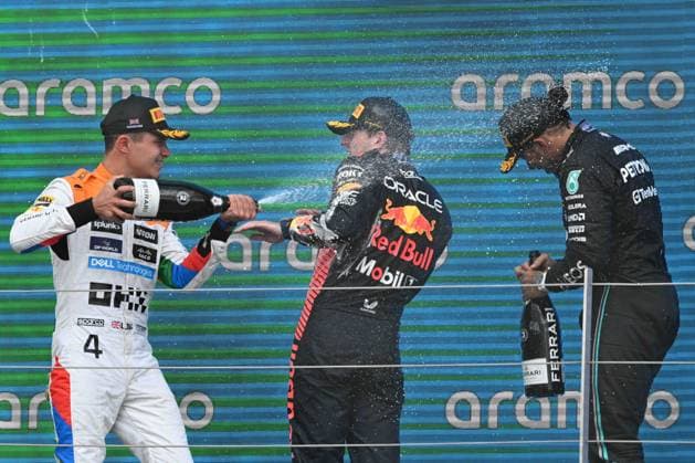 9th July 2023: Silverstone Circuit, Northamptonshire, England: Formula 1 2023 Aramco British F1 Grand Prix: Race Day; Lando Norris of the McLaren-Mercedes team sprays Max Verstappen of the Red Bull Racing team with Champagne  ActionPlus12529318 SimonxWest