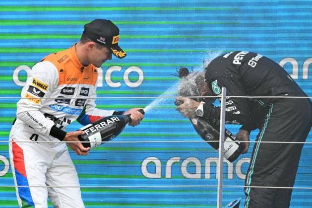 9th July 2023: Silverstone Circuit, Northamptonshire, England: Formula 1 2023 Aramco British F1 Grand Prix: Race Day; Lando Norris of the McLaren-Mercedes team sprays Lewis Hamilton of the Mercedes team with Champagne  ActionPlus12529319 SimonxWest