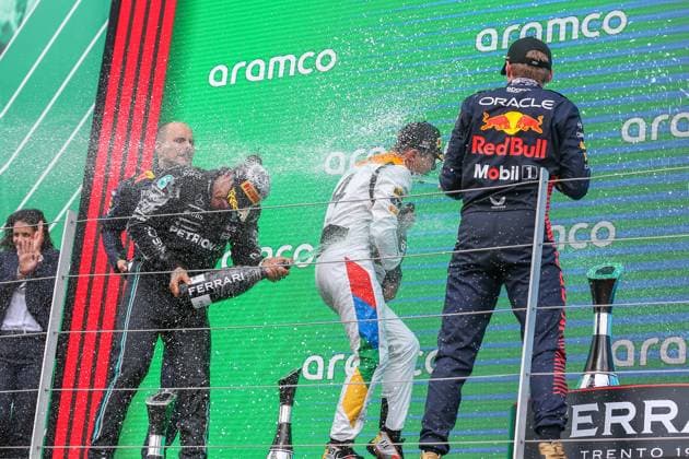 FORMULA 1 ARAMCO BRITISH GRAND PRIX 2023, 09 07 2023 Lando Norris 4 (GBR), McLaren MCL60 gets sprayed with champagne from Max Verstappen 1 (NED), HONDA Red Bull Racing RB19 and Lewis Hamilton 44 (GBR), Mercedes AMG Petronas W14 during the FORMULA 1 ARAMCO BRITISH GRAND PRIX 2023 at the Silverstone Circuit, Silverstone, United Kingdom on 9 July 2023 Editorial Use Only Copyright: xPhilxDuncanx ESM-0744-0025