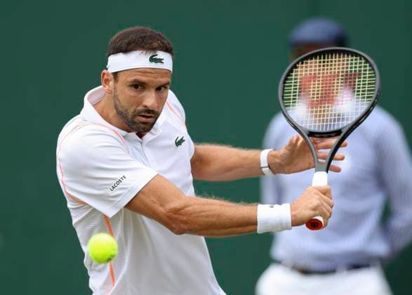 (230709) -- LONDON, July 9, 2023 -- Grigor Dimitrov hits a return during the men s singles third round match between Frances Tiafoe of the United States and Grigor Dimitrov of Bulgaria at Wimbledon Tennis Championships in London, Britain, July 9, 2023. ) (SP)BRITAIN-LONDON-TENNIS-WIMBLEDON-DAY 7 HanxYan 