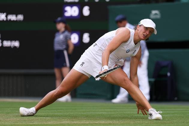 9th July 2023; All England Lawn Tennis and Croquet Club, London, England: Wimbledon Tennis Tournament; Iga Swiatek slips during her match with Belinda Bencic  ActionPlus12529494 ShaunxBrooks