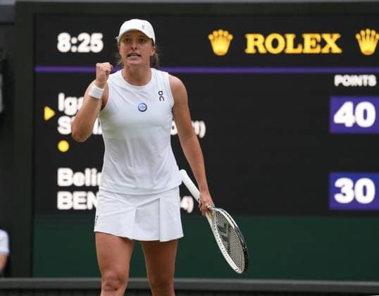 Tennis - 2023 Wimbledon Championships - Week One - Day Seven - All England lawn Tennis & Racquet Club, Wimbledon - Sunday 9th Ladies singles - Iga Swiatek (POL) v Belinda Bencic (SUI) Iga Swiatek celebrates winning match point 