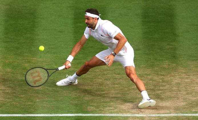 Mandatory Credit: Photo by Ella Ling Shutterstock (14003751ee) Grigor Dimitrov in action again Holger Rune Wimbledon Tennis Championships, Day 8, The All England Lawn Tennis and Croquet Club, London, UK - 10 Jul 2023 Wimbledon Tennis Championships, Day 8, The All England Lawn Tennis and Croquet Club, London, UK - 10 Jul 2023  Copyright: xEllaxLing Shutterstockx 14003751ee