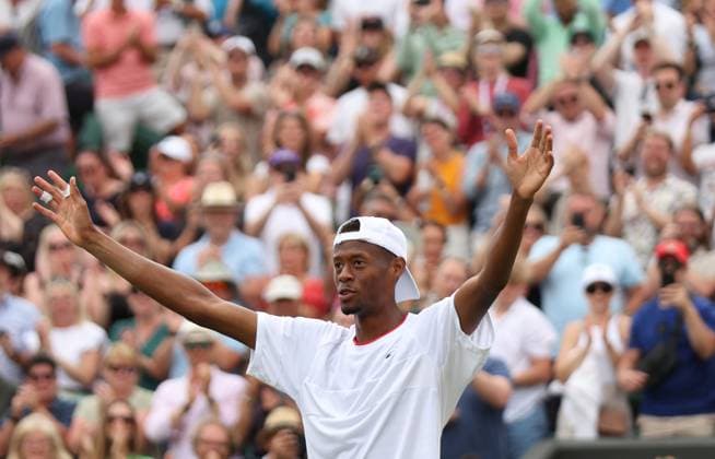 American Chris Eubanks celebrates victory in his match against Greece s Stefanos Tsitsipas on day eight of the 2023 Wimbledon championships in London on Monday, July 10, 2023.  LON2023071062 HUGOxPHILPOTT