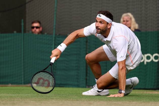 10th July 2023; All England Lawn Tennis and Croquet Club, London, England: Wimbledon Tennis Tournament; Grigor Dimitrov slips during his match with Holger Rune  ActionPlus12529967 ShaunxBrooks