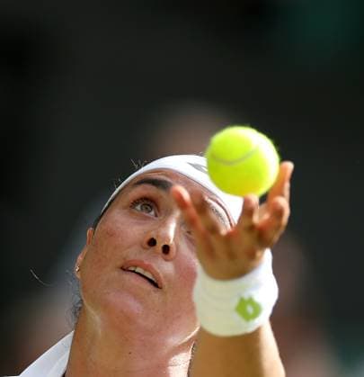 (230711) -- LONDON, July 11, 2023 -- Ons Jabeur serves during the women s singles fourth round match between Ons Jabeur of Tunisia and Petra Kvitova of the Czech Republic at Wimbledon tennis Championship in London, Britain, on July 10, 2023. ) (SP)BRITAIN-LONDON-TENNIS-WIMBLEDON-DAY 8 LixYing 