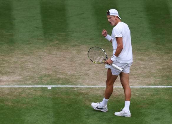 (230711) -- LONDON, July 11, 2023 -- Holger Rune reacts during the men s singles fourth round match between Holger Rune of Denmark and Grigor Dimitrov of Bulgaria at Wimbledon tennis Championship in London, Britain, on July 10, 2023. ) (SP)BRITAIN-LONDON-TENNIS-WIMBLEDON-DAY 8 HanxYan 