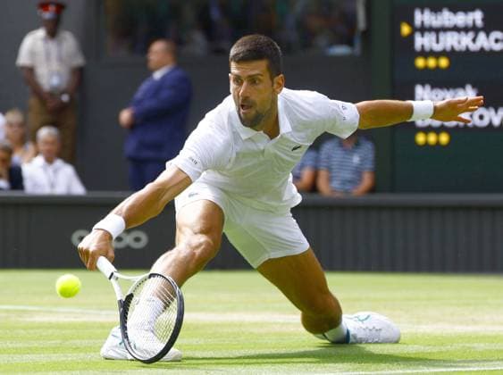 Tennis: Wimbledon championships Novak Djokovic of Serbia plays against Hubert Hurkacz of Poland in the men s singles fourth round at the Wimbledon tennis tournament in London on July 10, 2023, following the postponement of the match the previous day due to Wimbledon s 11 p.m. curfew.  A14AA0001669953P  