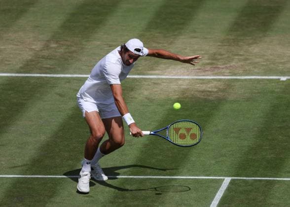 11th July 2023; All England Lawn Tennis and Croquet Club, London, England: Wimbledon Tennis Tournament; Lloyd Harris (RSA) with a backhand shot to Horacio Zeballos (ARG) mens doubles round of 16  ActionPlus12530075 JohnxPatrickxFletcher