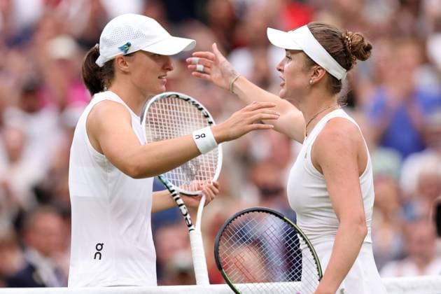 11th July 2023; All England Lawn Tennis and Croquet Club, London, England: Wimbledon Tennis Tournament; Elina Svitolina embraces Iga Swiatek after she wins the match in the womens singles quarter-final match  ActionPlus12530213 ShaunxBrooks
