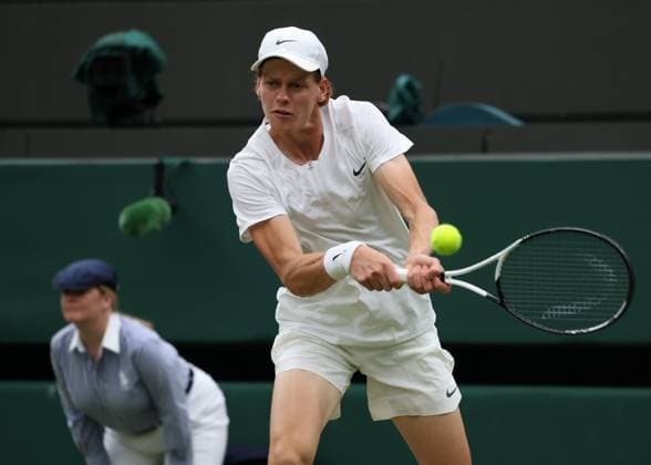 11th July 2023; All England Lawn Tennis and Croquet Club, London, England: Wimbledon Tennis Tournament; Jannik Sinner (ITA) with a backhand shot to Roman Safiullin (RUS)  ActionPlus12530271 JohnxPatrickxFletcher