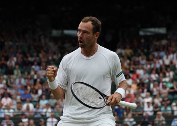 11th July 2023; All England Lawn Tennis and Croquet Club, London, England: Wimbledon Tennis Tournament; Roman Safiullin (RUS) celebrates towards his coaches after winning an important game against Jannik Sinner (ITA)  ActionPlus12530274 JohnxPatrickxFletcher